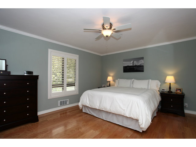 1115 Continentals Way, Unit 203 Belmont, CA 94002 - Photo 8 of 16 a bedroom with a bed and a closet