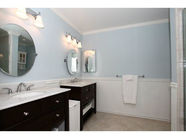 1115 Continentals Way, Unit 203 Belmont, CA 94002 - Photo 10 of 16 a bathroom with a double vanity sink and a mirror