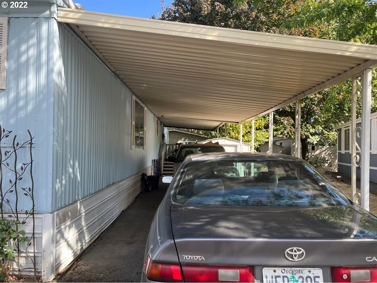 1475 Green Acres Road, Unit 142 Eugene, OR 97408 - Photo 9 of 14 a view of garage with car parked