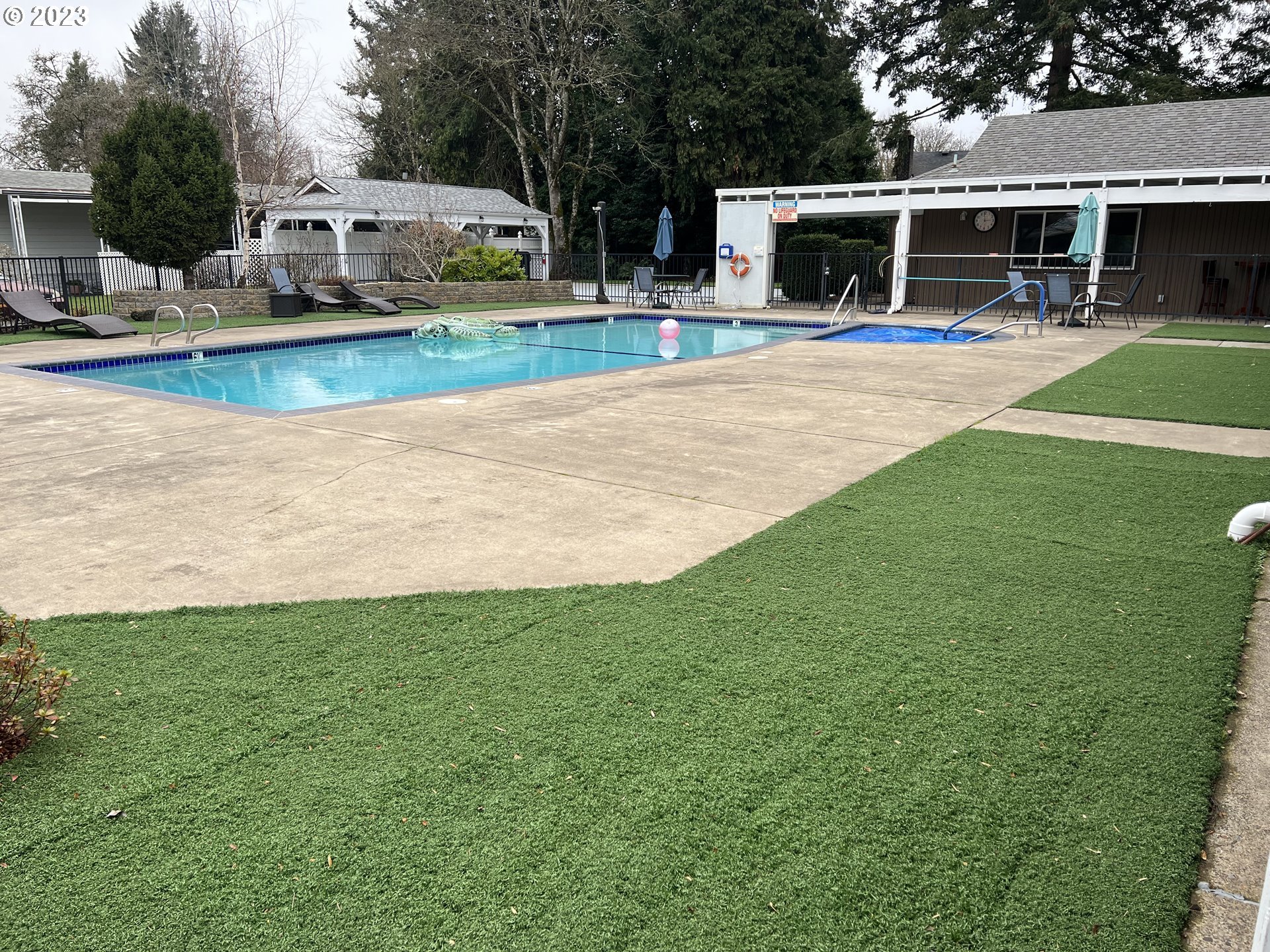 1475 Green Acres Road, Unit 142 Eugene, OR 97408 - Photo 10 of 14 a view of a house with swimming pool and a yard