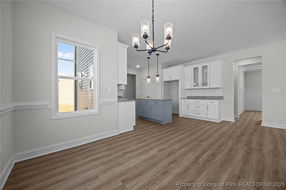 3202 Cameron Hill Road Cameron, NC 28326 - Photo 18 of 45 a view of a kitchen with furniture and wooden floor