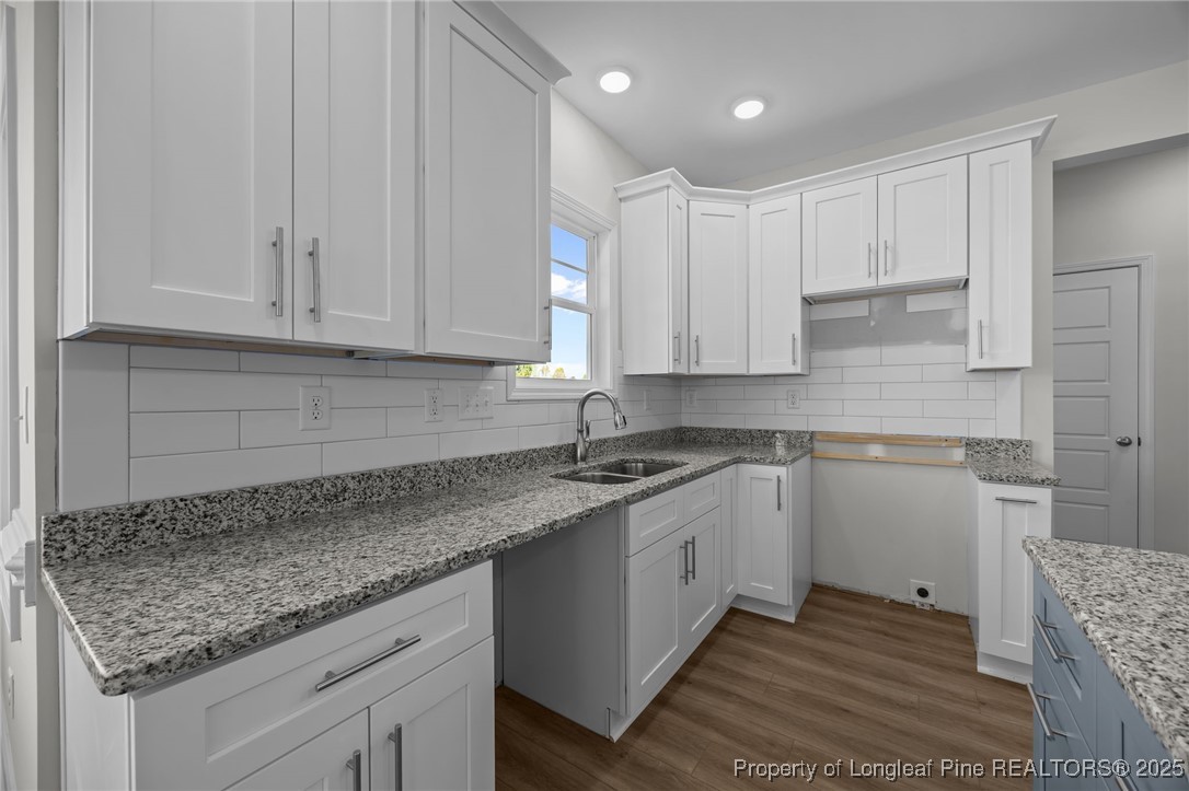 3202 Cameron Hill Road Cameron, NC 28326 - Photo 23 of 45 a kitchen with granite countertop a sink stainless steel appliances and cabinets