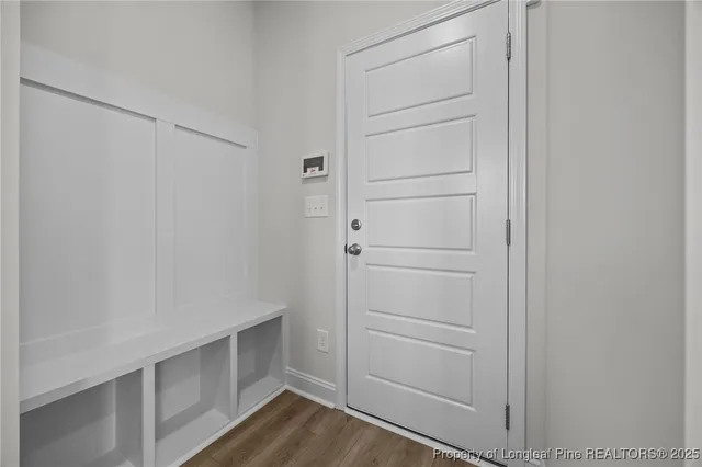 a bathroom with a sink toilet and a mirror