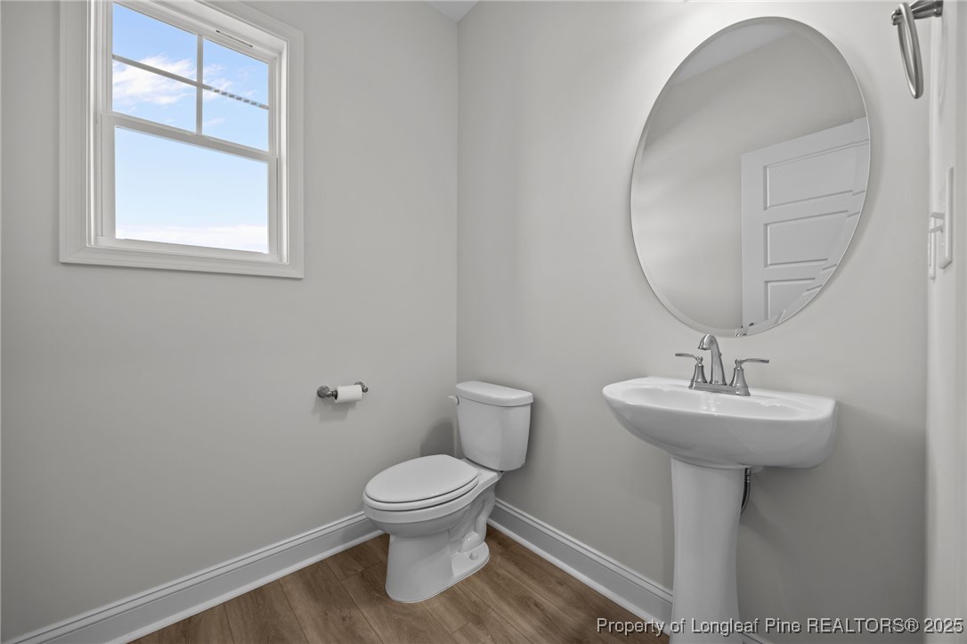 3202 Cameron Hill Road Cameron, NC 28326 - Photo 25 of 45 a bathroom with a sink toilet and a mirror