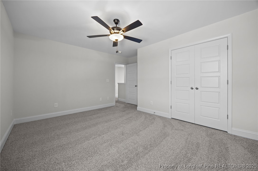 3202 Cameron Hill Road Cameron, NC 28326 - Photo 28 of 45 an empty room with closet and fan