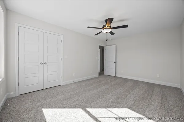 a bathroom with a double vanity sink toilet mirror and bathtub