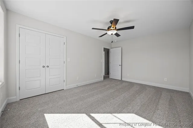 a bathroom with a double vanity sink toilet mirror and bathtub