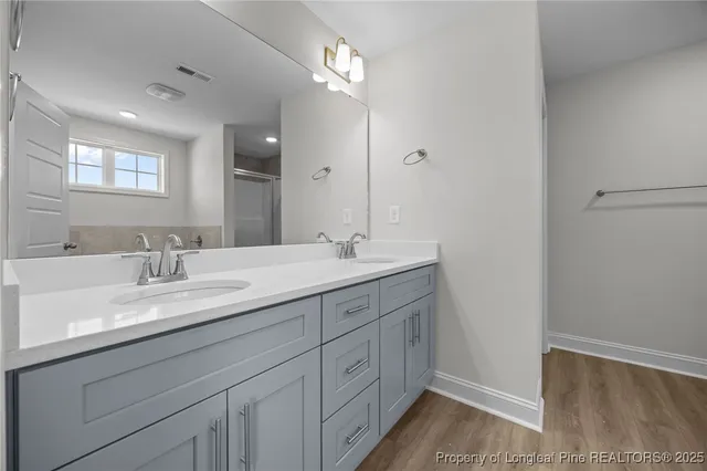 a white bath tub sitting next to a window
