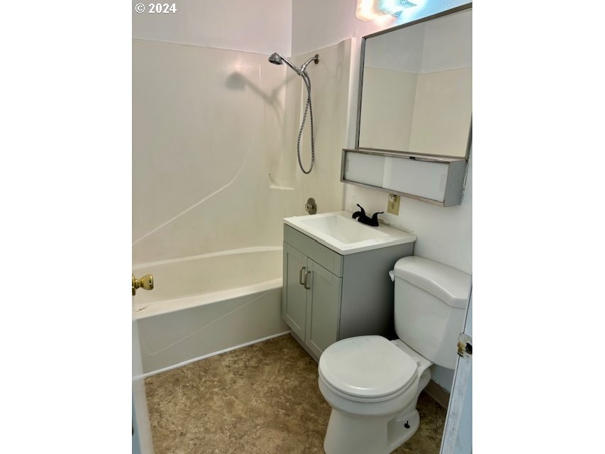 219-221 Northwest 13th Street Pendleton, OR 97801 - Photo 12 of 16 a bathroom with a sink toilet and shower