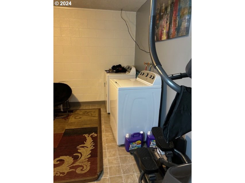 219-221 Northwest 13th Street Pendleton, OR 97801 - Photo 16 of 16 a view of walk in closet with clothes and shoes
