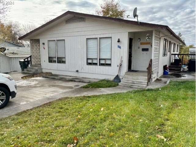 219-221 Northwest 13th Street Pendleton, OR 97801 - Photo 2 of 16 a view of a house with backyard and sitting area