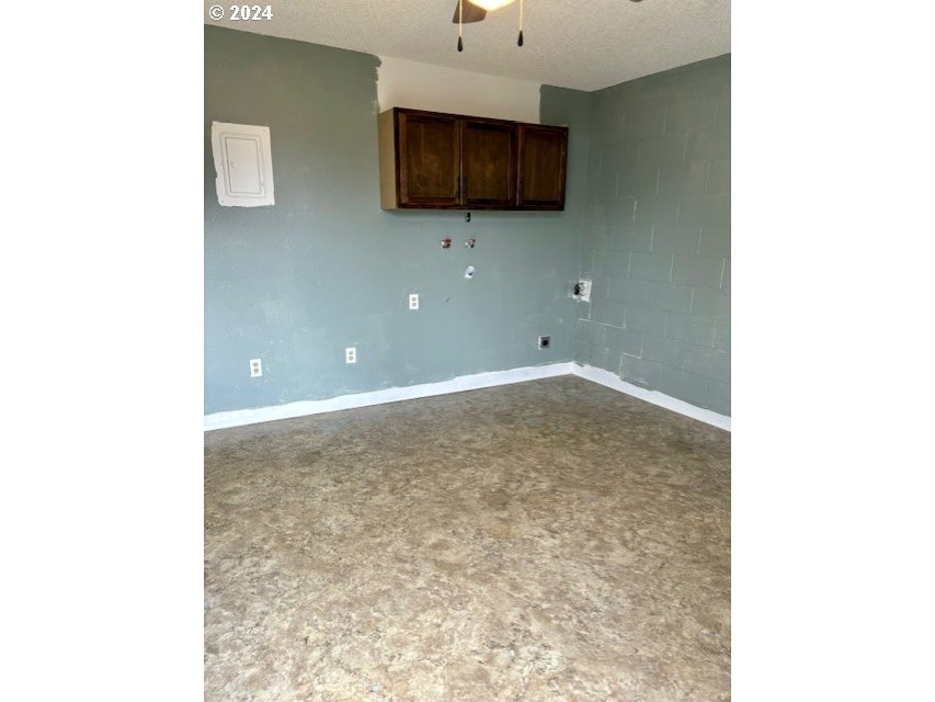 219-221 Northwest 13th Street Pendleton, OR 97801 - Photo 9 of 16 a living room with a couch and a flat screen tv