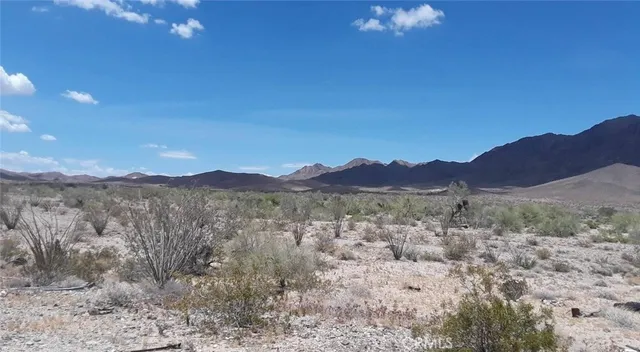 a view of a house with a mountain