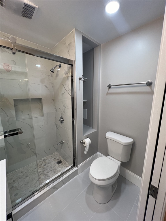 29 Ingalls Terrace, Unit 3 Swampscott, MA 01907 - Photo 9 of 13 a bathroom with a toilet and a shower