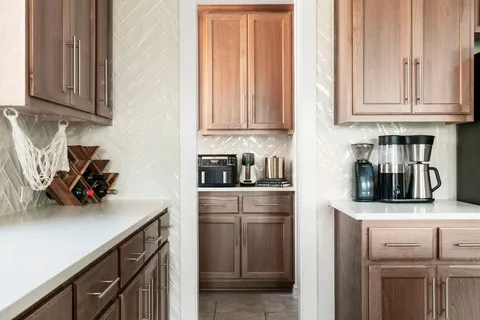a kitchen with stainless steel appliances granite countertop a sink and a stove