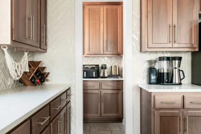 a kitchen with stainless steel appliances granite countertop a sink and a stove