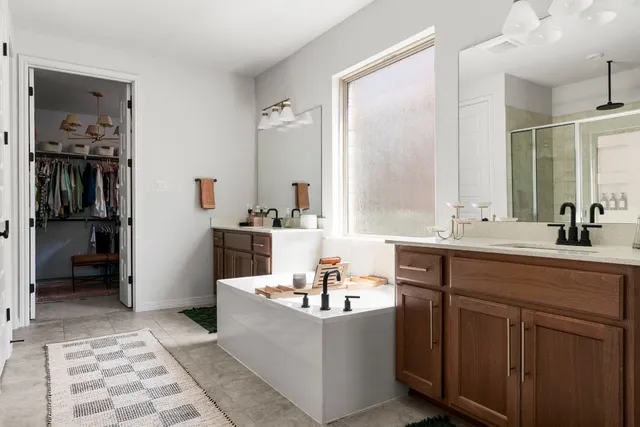 a bedroom with a bed chair and window