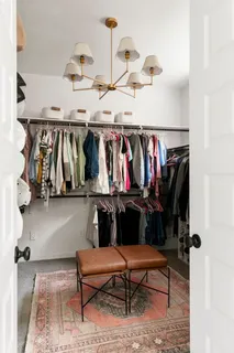 a view of hallway with livingroom and furniture