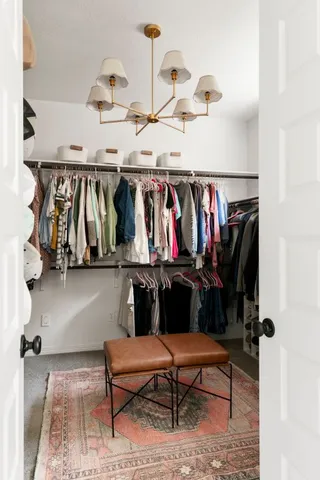 a view of hallway with livingroom and furniture