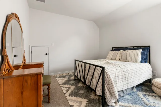 a view of a chairs and table in the balcony