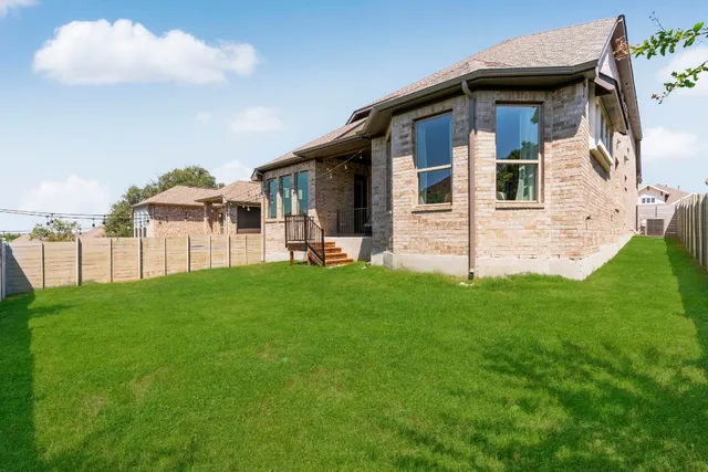 an aerial view of a house with a garden