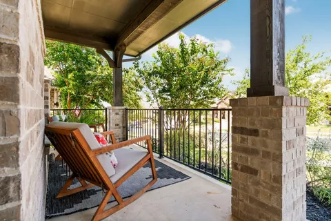 a view of a backyard with sitting area