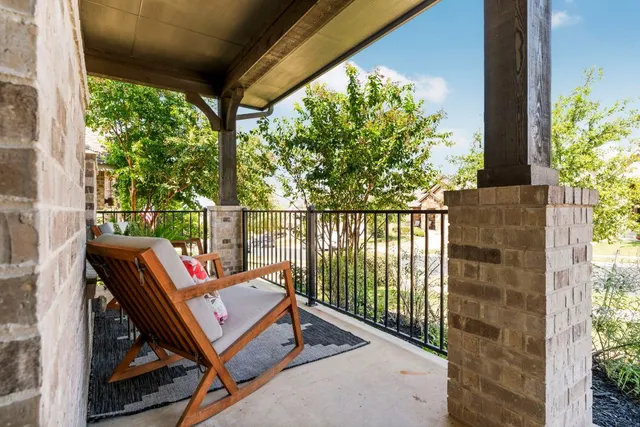 a view of a backyard with sitting area