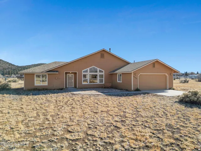 a house with yard in front of it