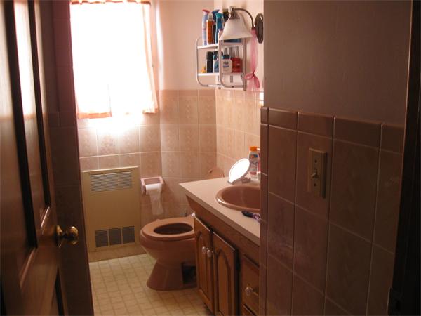 65 Oxford Street Fall River, MA 02721 - Photo 12 of 14 a bathroom with a sink and toilet