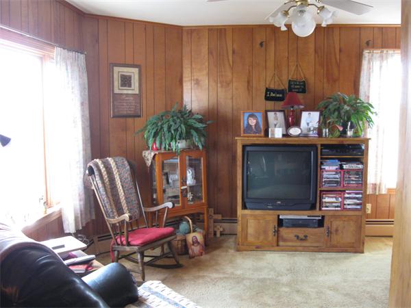 65 Oxford Street Fall River, MA 02721 - Photo 13 of 14 a living room with furniture and a flat screen tv