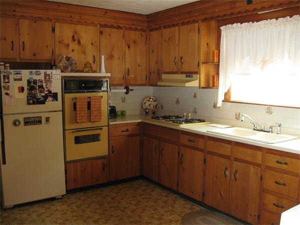 65 Oxford Street Fall River, MA 02721 - Photo 2 of 14 a kitchen with stainless steel appliances granite countertop a refrigerator and a stove top oven