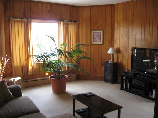 65 Oxford Street Fall River, MA 02721 - Photo 3 of 14 a living room with furniture and a potted plant