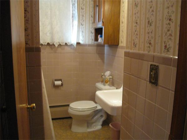 65 Oxford Street Fall River, MA 02721 - Photo 8 of 14 a white toilet sitting next to a bathroom sink