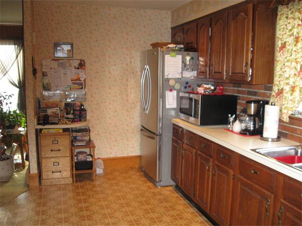 65 Oxford Street Fall River, MA 02721 - Photo 10 of 14 a kitchen with stainless steel appliances a refrigerator and stove