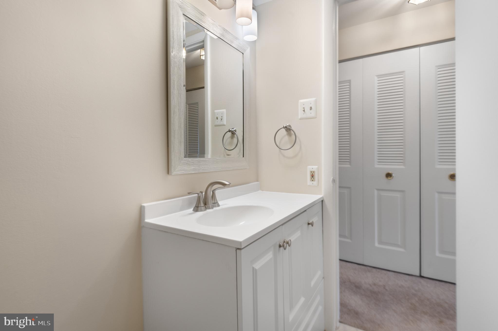 19027 Mills Choice Road, Unit 4 Gaithersburg, MD 20886 - Photo 22 of 41 Charming bathroom with modern elegance.