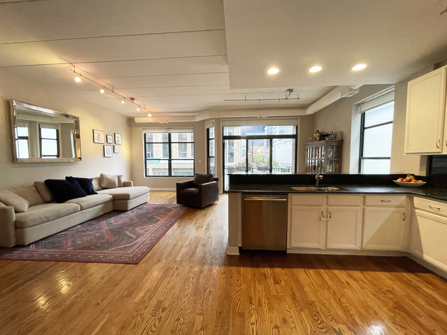 841 West Monroe Street, Unit 3A Chicago, IL 60607 - Photo 2 of 17 a living room with furniture and a wooden floor
