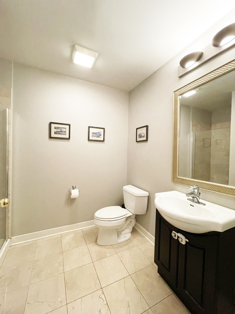 841 West Monroe Street, Unit 3A Chicago, IL 60607 - Photo 14 of 17 a bathroom with a sink and a toilet