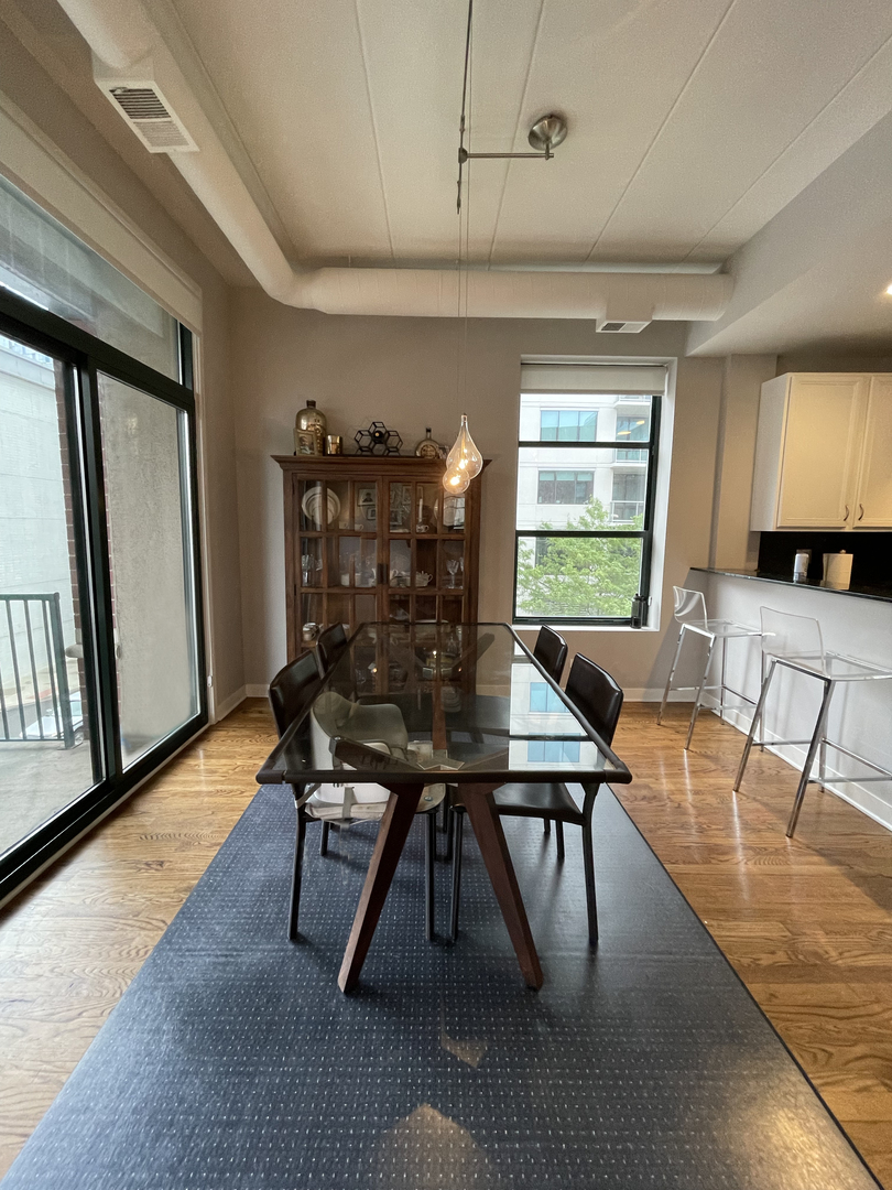 841 West Monroe Street, Unit 3A Chicago, IL 60607 - Photo 6 of 17 a workspace with furniture window and wooden floor