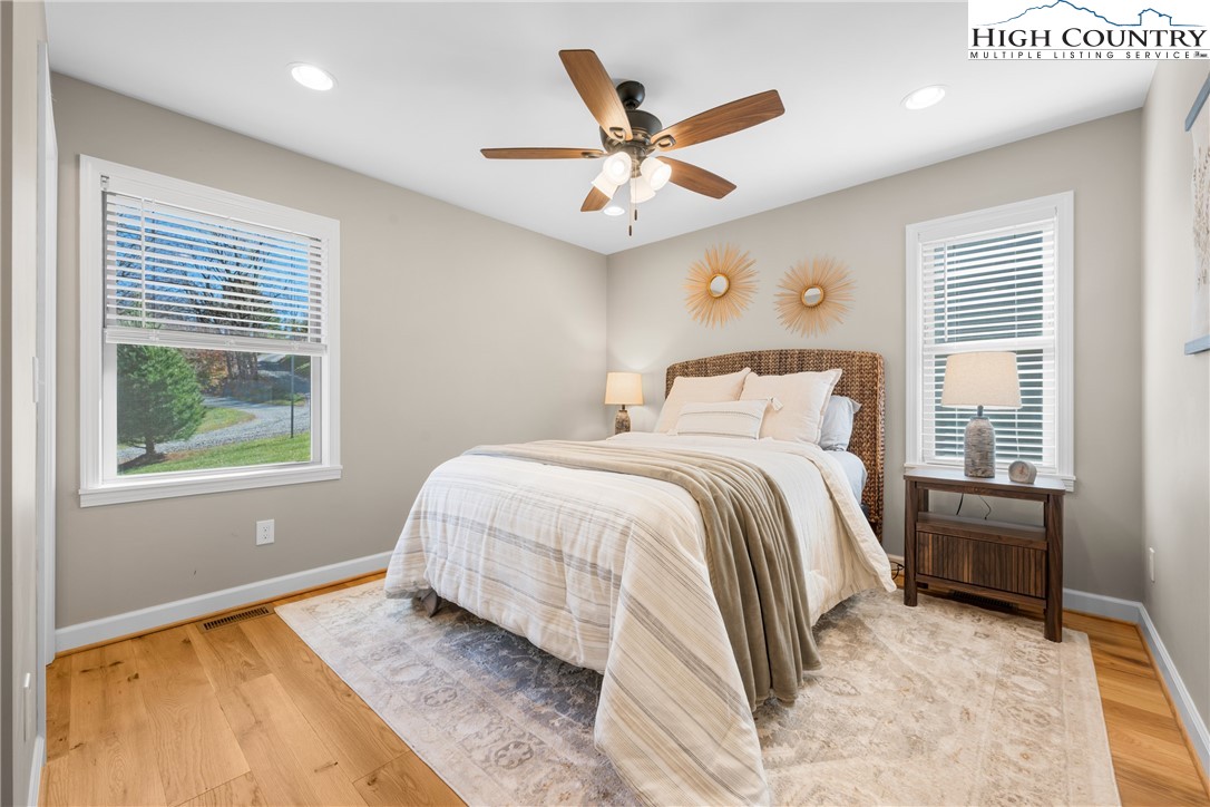 129 Pinebrook Court, Unit 4 Boone, NC 28607 - Photo 16 of 33 a bedroom with a bed and a large window