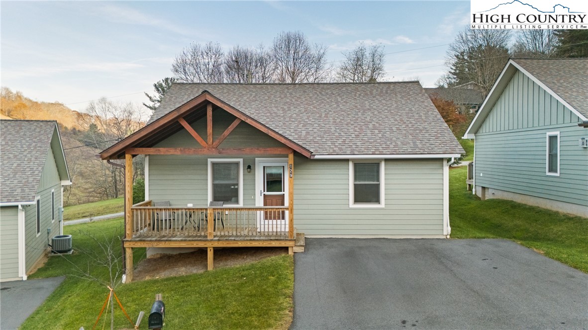 129 Pinebrook Court, Unit 4 Boone, NC 28607 - Photo 2 of 33 a front view of a house with a yard