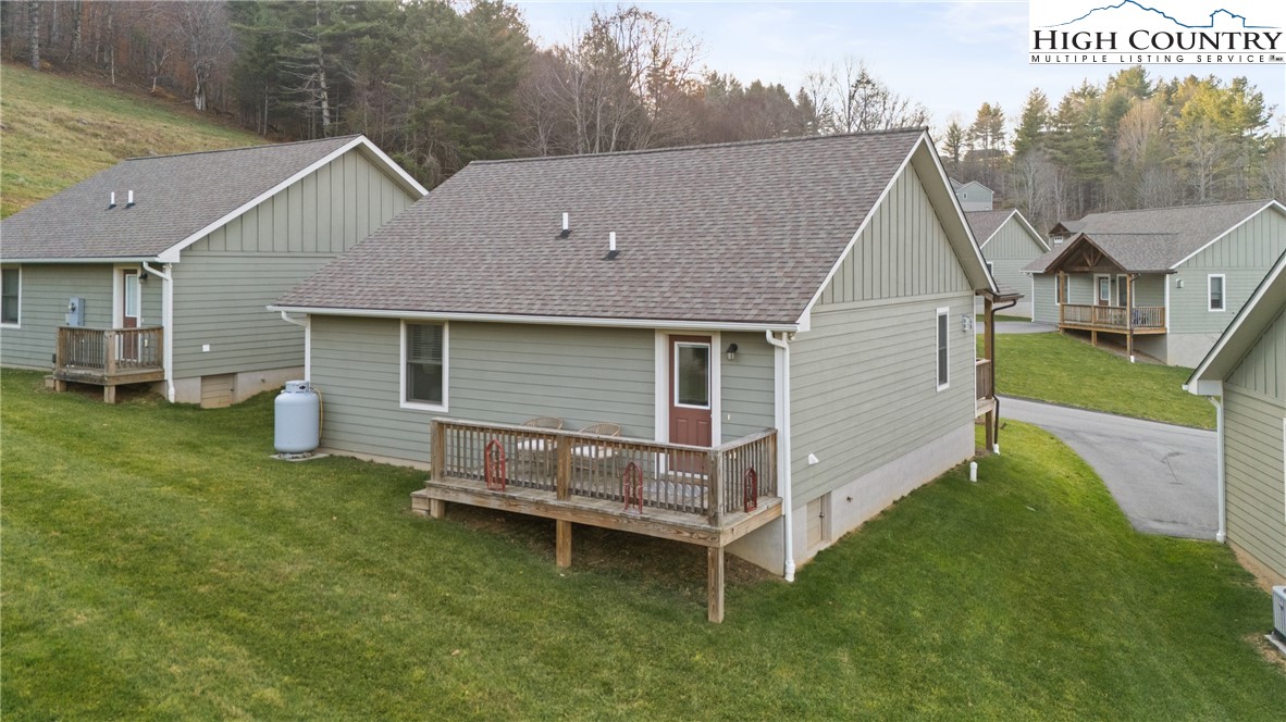 129 Pinebrook Court, Unit 4 Boone, NC 28607 - Photo 29 of 33 a view of a house with a yard and sitting area