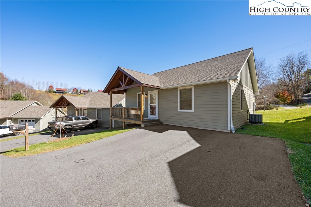 129 Pinebrook Court, Unit 4 Boone, NC 28607 - Photo 4 of 33 a view of a house with outdoor space and backyard