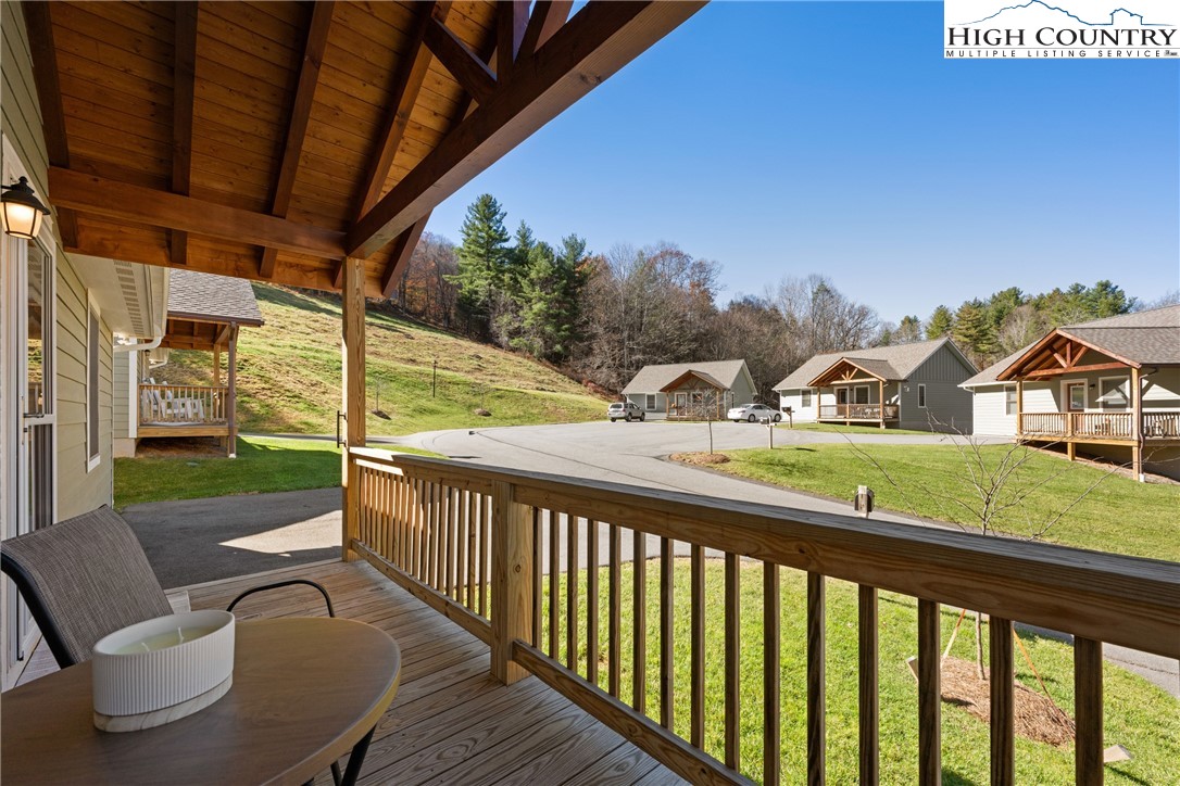 129 Pinebrook Court, Unit 4 Boone, NC 28607 - Photo 6 of 33 a view of a two chairs in the balcony