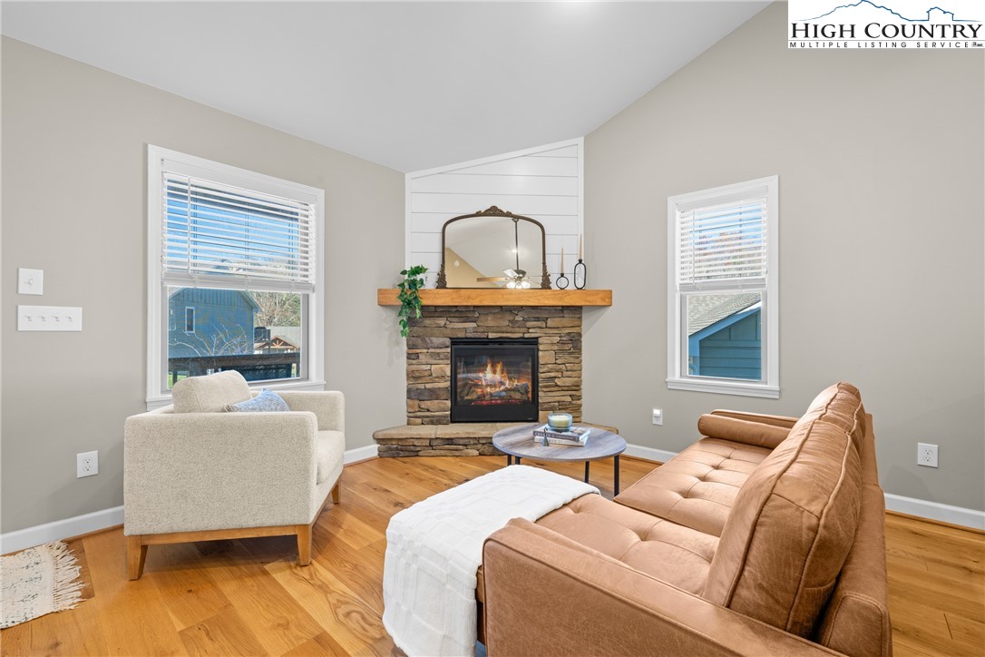 129 Pinebrook Court, Unit 4 Boone, NC 28607 - Photo 9 of 33 a living room with a couch and a fireplace