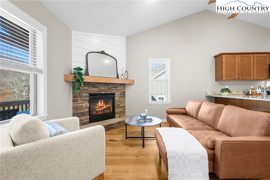 129 Pinebrook Court, Unit 4 Boone, NC 28607 - Photo 10 of 33 a living room with furniture and a fireplace