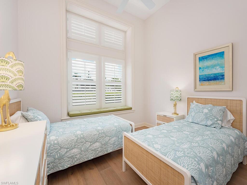 165 5th Street South, Unit 3 Naples, FL 34102 - Photo 12 of 20 a bedroom with a bed and a window