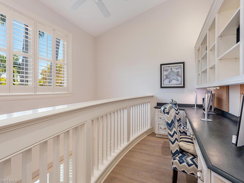 165 5th Street South, Unit 3 Naples, FL 34102 - Photo 15 of 20 a view of a livingroom with furniture and a flat screen tv