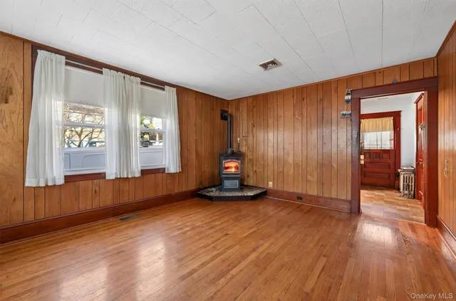 a view of a room with wooden floor and stairs