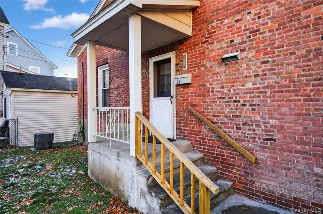 a view of a balcony with wooden floor