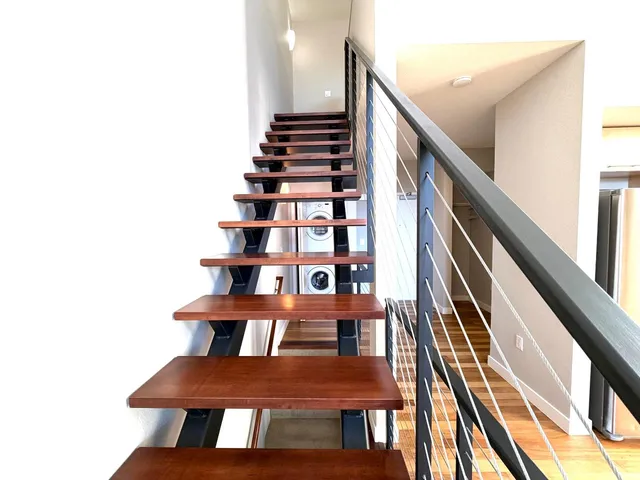 a bathroom with a toilet and a tub